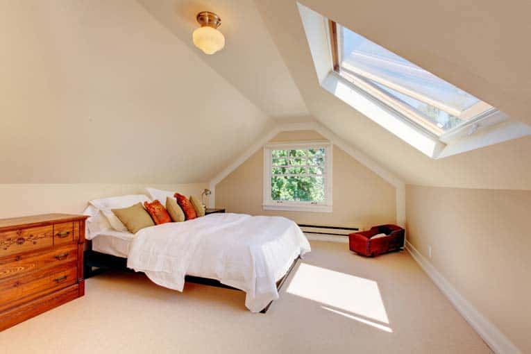 Operable skylight can be opened for generous ventilation. In an attic room like this, a hand-operated latch is easy to use.