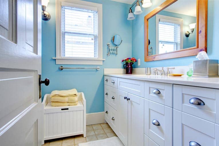 White painted cabinets are cheerful—and a great way to stretch remodeling dollars.