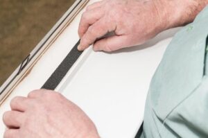 applying foam window weatherstripping