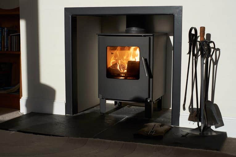 Wood-burning fireplace insert makes a conventional fireplace far more efficient.
