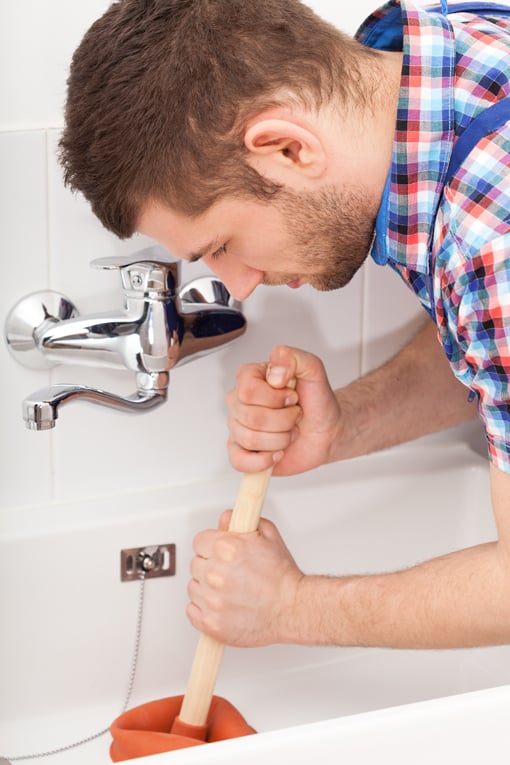 plunging drain clog in bath tub