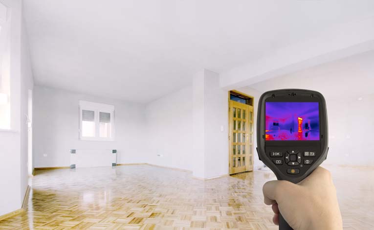 From inside a house, an infrared thermal detector can see energy leakage around doors and windows.