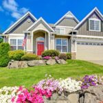 house with lawn flowers door