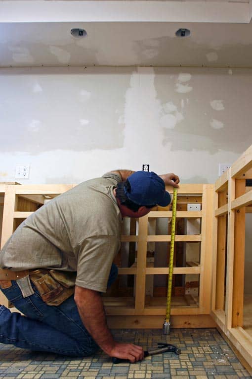 Before beginning installation, check the sizing of all cabinets against the room's measurements to make sure everything will fit properly.