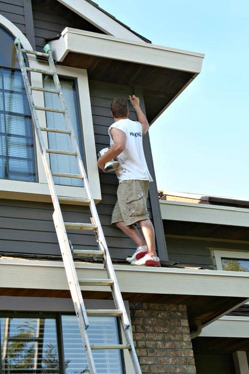 painting wood siding with brush