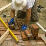 laying bricks in sand