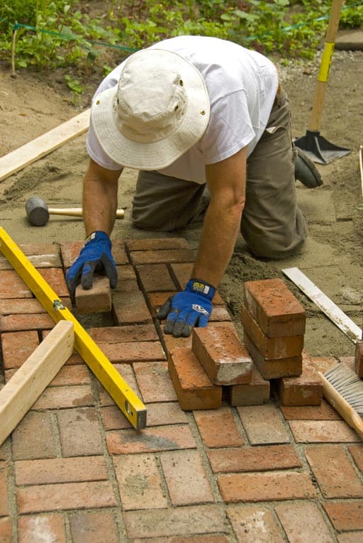 laying bricks in sand