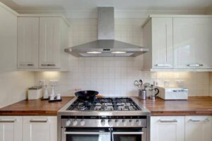 gas stove stainless vent hood wood counters