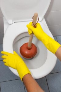 When plunging a toilet, seat a bell-shaped plunger over the drain hole.