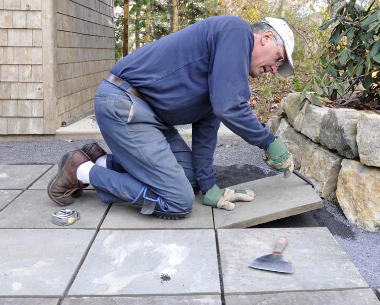 Concrete pavers, set in a base of compacted sand, provide a flat, elegant patio surface.