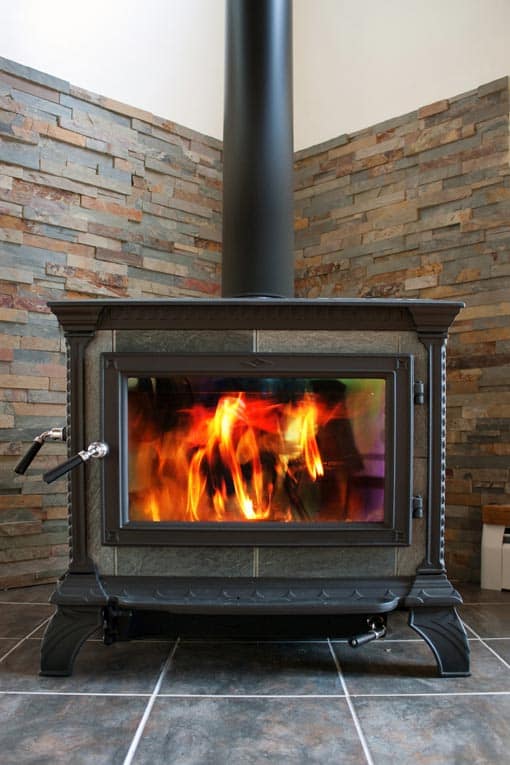 The basic elements of a wood stove installation are 1) the stove, 2) a flue, and 3) a non-combustible hearth and wall.