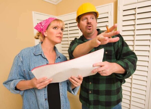 contractor and homeowner discuss plans