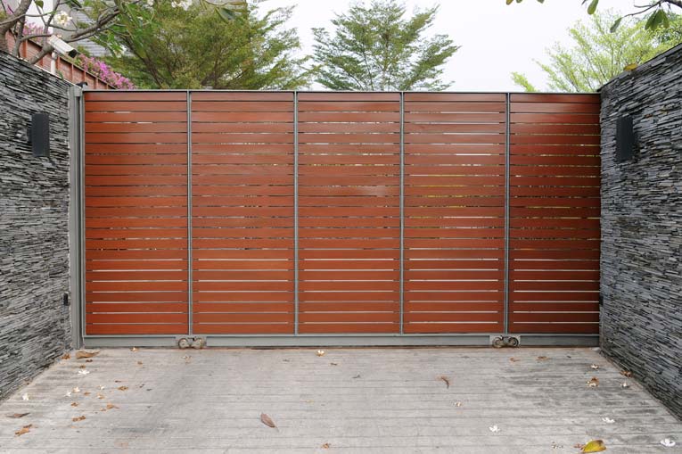 Security and privacy are maximized with this steel and wood gate.