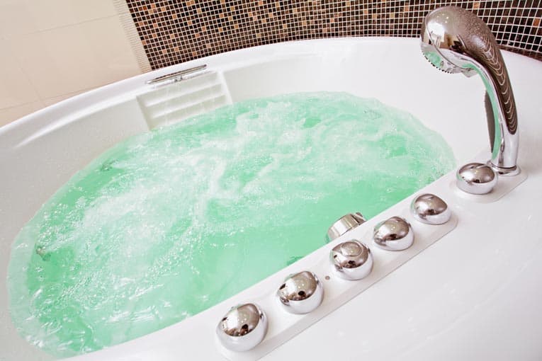 Whirlpool bathtub churns up a luxurious, soothing bath. Many shapes and styles are made.