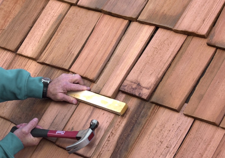 Drive the replacement shingle up into place, leaving it's butt about 3/4 inch lower than the adjacent shingles. 