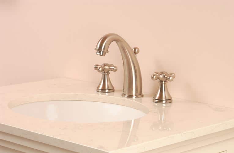 Picture of a newly-installed bathroom sink bowl and faucet. 