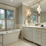 bathroom remodel with large window and soaking tub