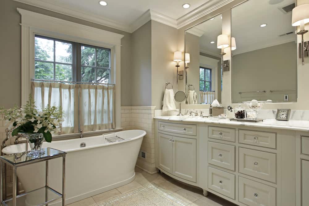 bathroom remodel with large window and soaking tub