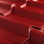 Closeup of textured red metal roofing.