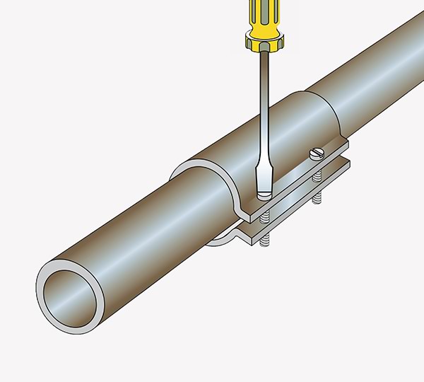 A screwdriver attaching a sleeve clamp to a leaky pipe