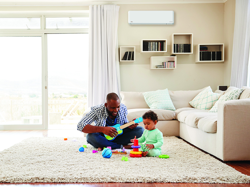 Father and son playing in living room