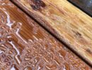 water beading on surface of stained deck