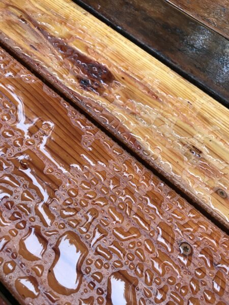 water beading on surface of stained deck