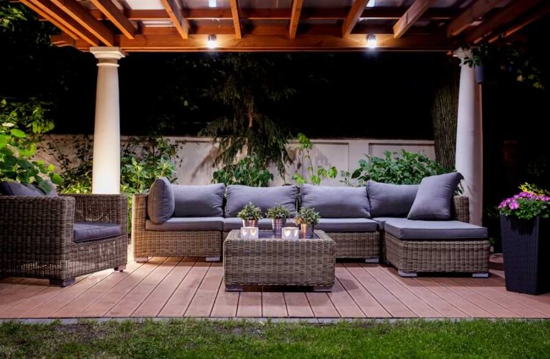 pergola with lighting on tile patio