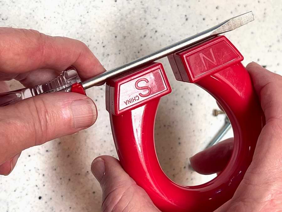 magnet moves along screwdriver blade