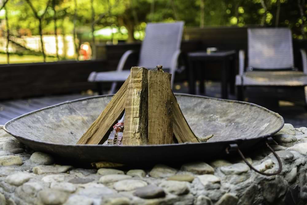 wood stacked in fire pit for burning