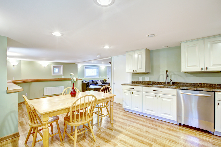 bright basement kitchen with light toned surfaces