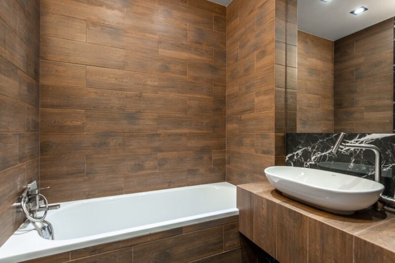 basement bathroom with laminate walls